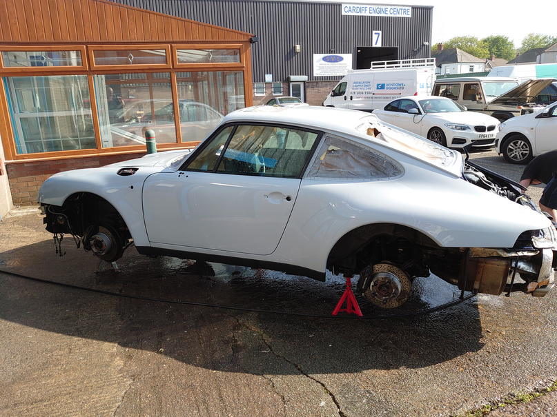 a porsche car with alloy wheels of having a detailing wash before spraying paint to blue, in south wales, cardiff
